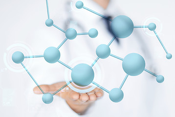 Image showing close up of male doctor hand with molecules