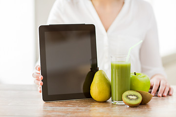 Image showing close up of woman hands tablet pc and fruit juice