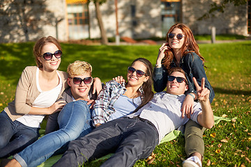 Image showing group of happy students showing victory gesture