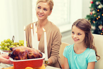 Image showing smiling family having holiday dinner at home