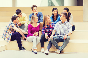 Image showing group of smiling students with paper coffee cups