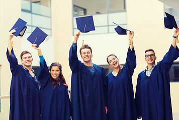 Image showing group of smiling students in mortarboards