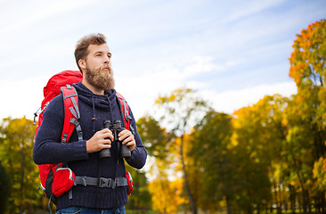 Image showing man with backpack and binocular outdoors