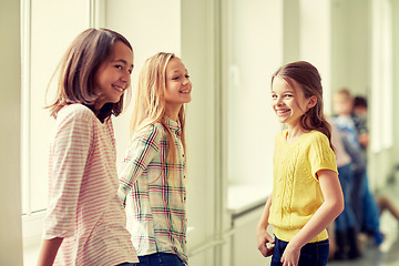Image showing group of smiling school kids in corridor