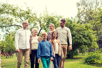 Image showing happy family in front of house outdoors