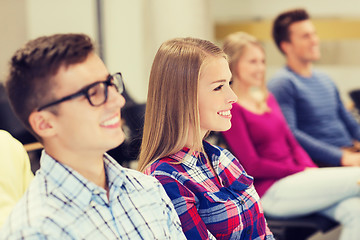 Image showing group of smiling students in lecture hall