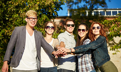 Image showing group of students or teenagers with hands on top