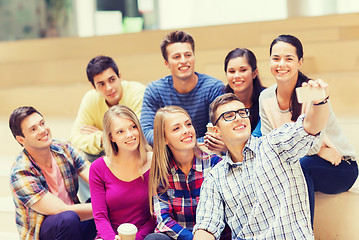 Image showing group of students with smartphone and coffee cup