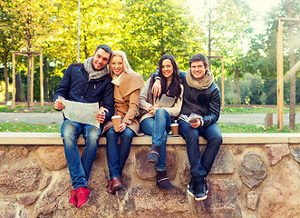 Image showing group of friends with map outdoors