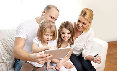 Image showing happy family with tablet pc and credit card