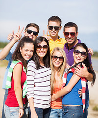 Image showing group of happy friends having fun on beach