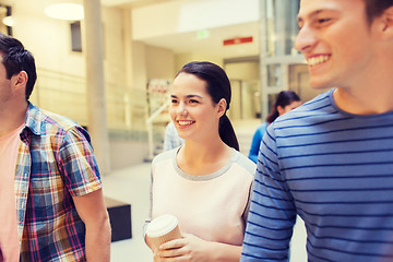 Image showing group of smiling students with paper coffee cups