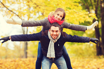 Image showing smiling couple having fun in autumn park