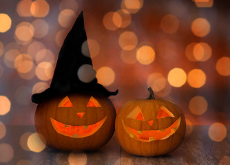 Image showing close up of pumpkins over holiday lights background