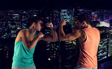 Image showing young men fighting hand-to-hand