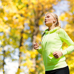 Image showing woman doing running outdoors