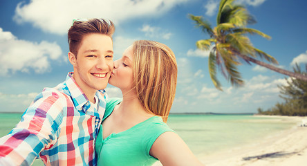 Image showing happy couple taking selfie on tropical beach