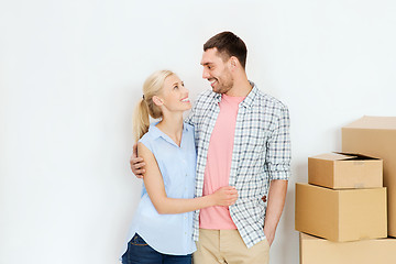 Image showing couple with cardboard boxes moving to new home