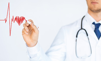 Image showing doctor drawing electrocardiogram on virtual screen