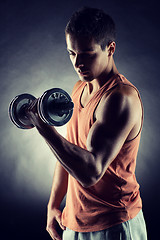 Image showing young man with dumbbell
