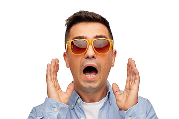 Image showing face of scared man in shirt and sunglasses