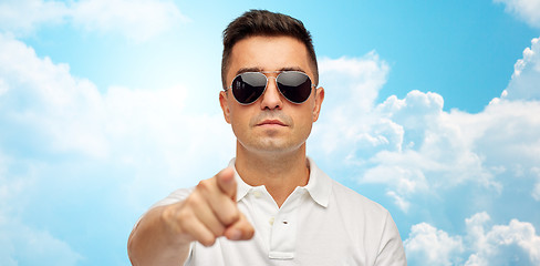 Image showing man in sunglasses pointing finger on you