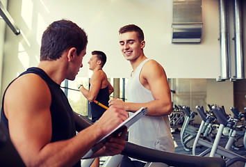 Image showing men exercising on treadmill in gym