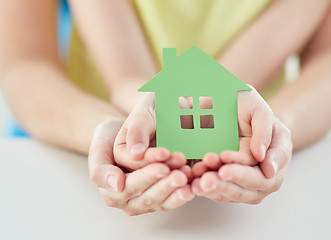 Image showing close up of woman and girl hands with paper house