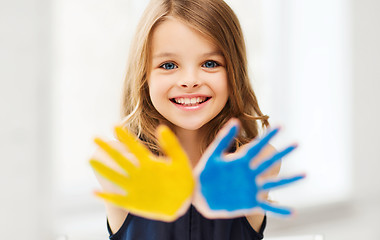 Image showing girl showing painted hands