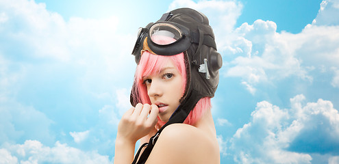 Image showing pink hair girl in aviator helmet over blue sky