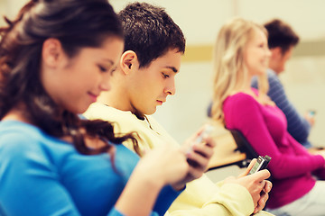 Image showing group of smiling students in lecture hall