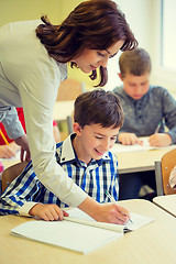 Image showing group of school kids writing test in classroom