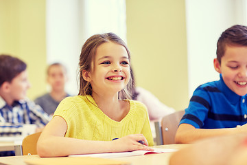 Image showing group of school kids writing test in classroom