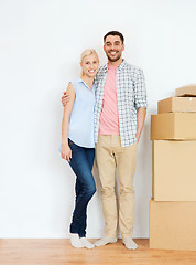 Image showing couple with cardboard boxes moving to new home