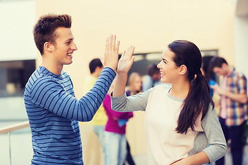 Image showing group of smiling students outdoors