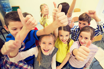 Image showing group of school kids showing thumbs up