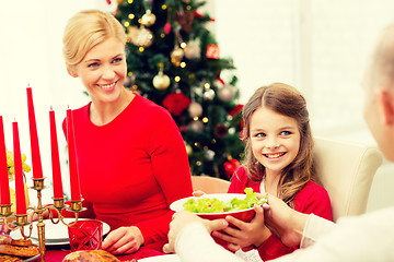 Image showing smiling family having holiday dinner at home