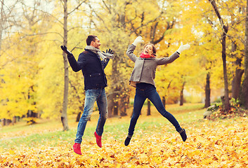 Image showing smiling couple having fun in autumn park