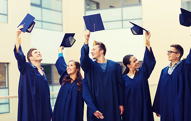 Image showing group of smiling students in mortarboards