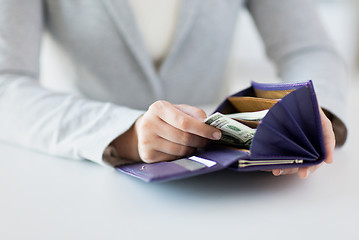 Image showing close up of woman hands with wallet and money