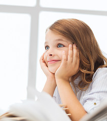 Image showing student girl writing in notebook at school