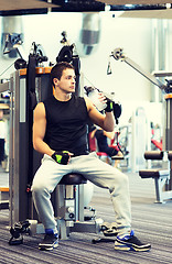 Image showing man exercising on gym machine