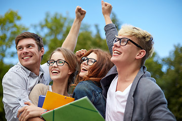 Image showing group of happy students showing triumph gesture