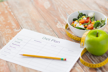 Image showing close up of diet plan and food on table