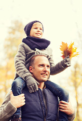 Image showing happy family having fun in autumn park