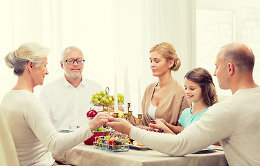 Image showing smiling family having holiday dinner at home