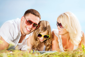 Image showing happy family with tablet pc