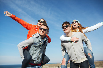 Image showing happy friends in shades having fun outdoors