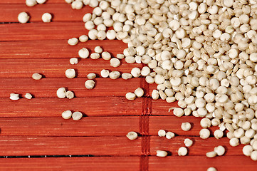 Image showing Quinoa and a wooden background.