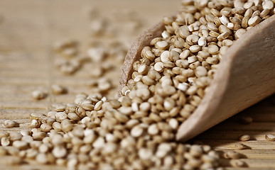 Image showing Quinoa and a wooden spatula.